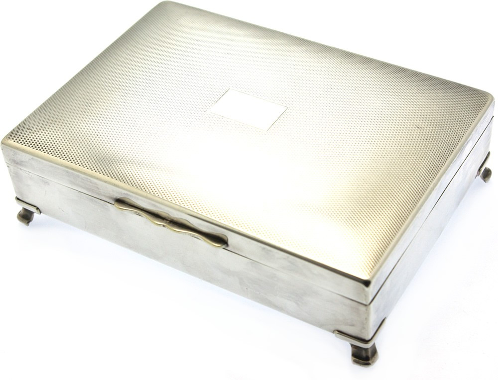 silver plated playing card box with 4 legs.