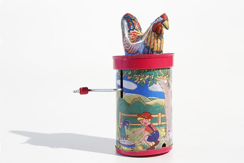 Clucking rooster tin toy