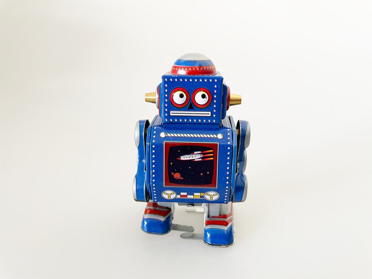 Little blue robot toy top