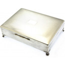 silver plated playing card box with 4 legs.
